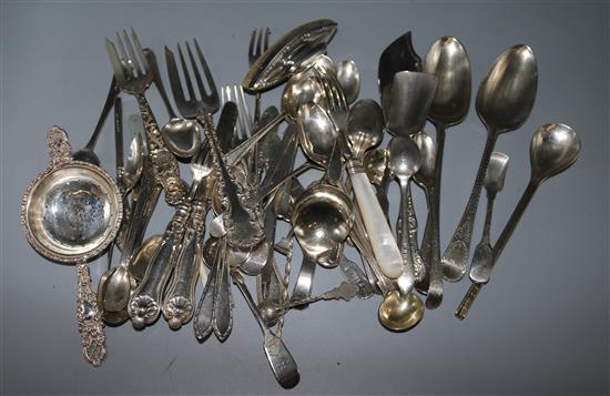 A small collection of silver flatware including 18th century spoon and manicure set